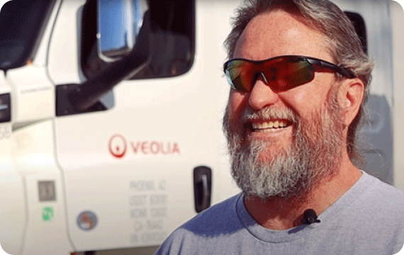 james-cdl-driver-front-of-truck-smiling